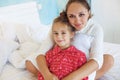 Mom with daughter in the bed Royalty Free Stock Photo