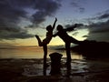 Dancers in sunset at sea Royalty Free Stock Photo