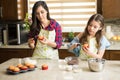 Mom and daughter decorating cupcakes Royalty Free Stock Photo