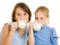Mom and daughter drink milk. Royalty Free Stock Photo