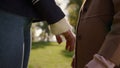 Mom daughter holding hands in sunny park together closeup. Happy mother child. Royalty Free Stock Photo