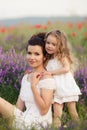 Mom and daughter on a lavender field