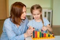 Mom with daughter learning to add and subtract