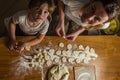 Mom and daughter are making flour out of flour to cook dumplings