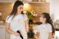 Mom and daughter making homemade healthy juice. Organic fruits and vegetables. Vegan beverage Royalty Free Stock Photo