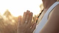 Mom and daughter meditate at sunrise outdoor