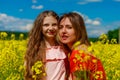 Mom and daughter in nature outdoors lifestyle. Good vacation concept
