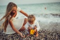 Mom and daughter near the sea