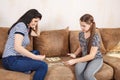 Mom and daughter play dominoes at home Royalty Free Stock Photo