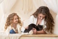 Mom and daughter playing with grey smoky british cat. happy family. mothers Day.  pet adoption. Royalty Free Stock Photo