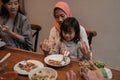 Mom and daughter pray before eating Royalty Free Stock Photo