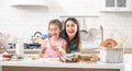 Mom and daughter prepare pastries in the kitchen Royalty Free Stock Photo