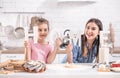 Mom and daughter prepare pastries in the kitchen Royalty Free Stock Photo