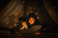 Mom and daughter read bedtime stories fairytale together before going to bed Royalty Free Stock Photo