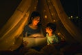 Mom and daughter read bedtime stories fairytale together before going to bed Royalty Free Stock Photo