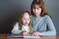 Mom and daughter reading a book