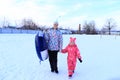 Mom and daughter ride a tubing in winter. Royalty Free Stock Photo