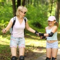 Mom and daughter ride on roller skates