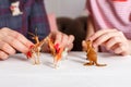 Mom and daughter spend time together, sit on the couch, chatting and playing with toy animals. Leisure mothers and daughters