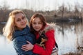 Mom, daughter and their pet chihuahua dog in their arms. Love to the animals. Family values Royalty Free Stock Photo