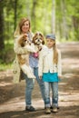 Mom and daughter walking in the park with the same two Shih Tzu dogs Royalty Free Stock Photo