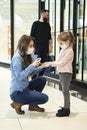 Mom disinfects her daughter`s hands while shopping at the mall Royalty Free Stock Photo