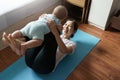 Mom exercising playing with her baby at home, Asian young mother lifting little boy in the air, Yoga, Workout Royalty Free Stock Photo