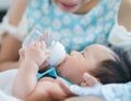 Mom feed power mile to her baby Royalty Free Stock Photo