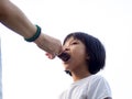 Mom Feeding Chinese Child an Ice Cream