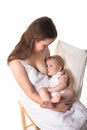 Mom feeds the baby breast, light background