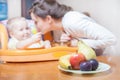 Mom feeds the baby pure. Juice. Drink Royalty Free Stock Photo