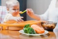 Mom feeds the baby soup. Healthy and natural baby food Royalty Free Stock Photo