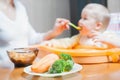 Mom feeds the baby soup. Healthy and natural baby food Royalty Free Stock Photo