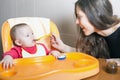 Mom feeds the baby soup. Healthy and natural baby food Royalty Free Stock Photo