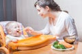 Mom feeds the baby soup. Healthy and natural baby food Royalty Free Stock Photo