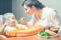 Mom feeds the baby soup. Healthy and natural baby food Royalty Free Stock Photo