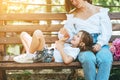 Mom feeds her little daughter ice cream in the park Royalty Free Stock Photo