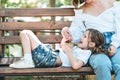 Mom feeds her little daughter ice cream in the park Royalty Free Stock Photo