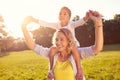 Mom and female child on her shoulders Royalty Free Stock Photo