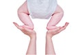 Mom female hands teach the infant baby toddler to crawl, isolated on a Royalty Free Stock Photo