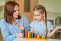 Mom with girl learning to add and subtract