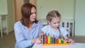 Mom with girl learning to add and subtract