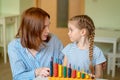 Mom with girl learning to add and subtract