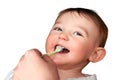 Mom hand is brushing the teeth of the happy toddler baby boy, isolated Royalty Free Stock Photo