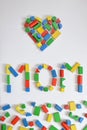 MOM and a heart with colorful wooden toy blocks Royalty Free Stock Photo