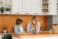 Mom helping little boy to do homework. Mother and son drawing together, mom helping with homework. Cute boy doing his school Royalty Free Stock Photo