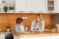 Mom helping little boy to do homework. Mother and son drawing together, mom helping with homework. Cute boy doing his school Royalty Free Stock Photo