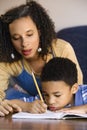 Mom helping son with homework Royalty Free Stock Photo