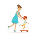 Mom Helping Son Ride A Scooter, Loving Mother Enjoying Good Quality Mommy Time With Happy Kid Royalty Free Stock Photo