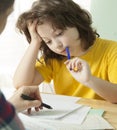Mom helps my son to do difficult homework, Unschooling Royalty Free Stock Photo